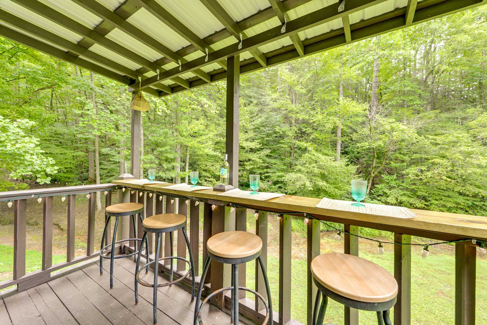 Deck bar seating with forest views